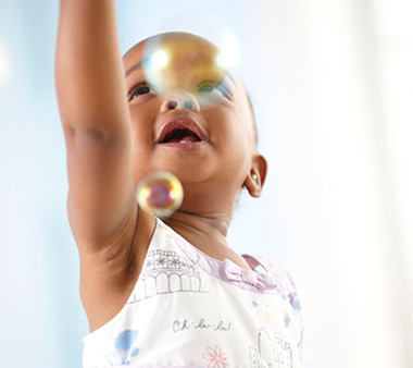 Baby Reaching for Bubbles